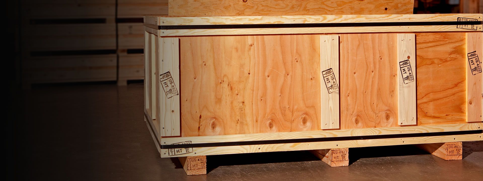 Custom wooden crates for on-site packing services - machinery, art, and fragile equipment shipping.